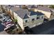 Exterior view of townhomes with tile roofs, attached garages, and well-maintained landscaping at 6313 Snap Ridge St # 201, North Las Vegas, NV 89081