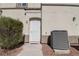 Exterior entrance features a white screen door, A/C unit, and minimal landscaping at 6313 Snap Ridge St # 201, North Las Vegas, NV 89081