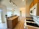 Well-lit kitchen features stainless appliances, a breakfast bar, and lots of open space at 6313 Snap Ridge St # 201, North Las Vegas, NV 89081
