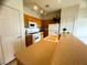 Compact kitchen featuring modern appliances and a breakfast bar with plenty of counter space at 6313 Snap Ridge St # 201, North Las Vegas, NV 89081