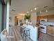 Spacious kitchen with breakfast bar and modern appliances, with open view to the living room at 6313 Snap Ridge St # 201, North Las Vegas, NV 89081
