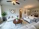 Bright living room area boasts hardwood floors and contemporary decor and furnishings at 6313 Snap Ridge St # 201, North Las Vegas, NV 89081