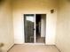 Cozy patio features a sliding glass door, neutral color palette, and space for seating at 6313 Snap Ridge St # 201, North Las Vegas, NV 89081