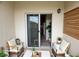 Cozy patio with comfortable seating, sliding glass door, and neutral color scheme at 6313 Snap Ridge St # 201, North Las Vegas, NV 89081