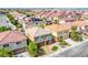 Beautiful aerial view of a suburban home with a well-kept yard, lush trees, and inviting curb appeal at 6630 Virtuoso Ct, Las Vegas, NV 89139