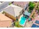 A private backyard with a sparkling pool, spa, and comfortable outdoor lounge area for ultimate relaxation at 6630 Virtuoso Ct, Las Vegas, NV 89139