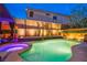 Serene backyard oasis featuring a pool, spa, stylish pergola, and lush landscaping at 6630 Virtuoso Ct, Las Vegas, NV 89139