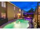 Inviting backyard with a sparkling pool, spa, pergola, and manicured landscaping at 6630 Virtuoso Ct, Las Vegas, NV 89139