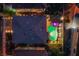 An aerial view shows a private backyard featuring a custom pool, patio, pergola and decorative string lights at 6630 Virtuoso Ct, Las Vegas, NV 89139