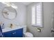 Stylish half bathroom with modern fixtures and blue vanity at 6630 Virtuoso Ct, Las Vegas, NV 89139