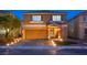 Inviting two-story home with well-manicured lawn and a two car garage at 6630 Virtuoso Ct, Las Vegas, NV 89139