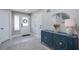 Inviting foyer with a stylish blue cabinet, decorative mirror, and neutral-toned rug at 6630 Virtuoso Ct, Las Vegas, NV 89139