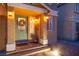 Charming front porch with decorative wreath and inviting lighting at 6630 Virtuoso Ct, Las Vegas, NV 89139