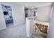 Upstairs hallway featuring carpeted floors and open staircase at 6630 Virtuoso Ct, Las Vegas, NV 89139