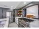 Gourmet kitchen featuring stainless steel appliances and a large gas range at 6630 Virtuoso Ct, Las Vegas, NV 89139