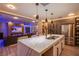 Open kitchen featuring a center island and stainless steel refrigerator at 6630 Virtuoso Ct, Las Vegas, NV 89139