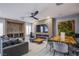 Comfortable living room featuring a modern fireplace, built-in wine rack, and contemporary furniture at 6630 Virtuoso Ct, Las Vegas, NV 89139