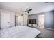 Spacious bedroom with connecting bathroom and modern ceiling fan at 6630 Virtuoso Ct, Las Vegas, NV 89139