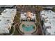 Aerial view showcasing the pool, community center, palm trees, and condo layout at 6800 E Lake Mead Blvd # 1126, Las Vegas, NV 89156