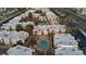 Aerial view of the condo community with mature trees, lush landscaping and a sparkling pool at 6800 E Lake Mead Blvd # 1126, Las Vegas, NV 89156