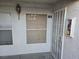 Condo front entrance featuring a security door and outdoor light fixture at 6800 E Lake Mead Blvd # 1126, Las Vegas, NV 89156