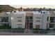Exterior view of a multi-Gathering building with white stucco and desert landscaping at 6800 E Lake Mead Blvd # 1126, Las Vegas, NV 89156