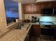 Bright kitchen featuring granite countertops and stainless steel appliances, blending functionality with style at 6800 E Lake Mead Blvd # 1126, Las Vegas, NV 89156
