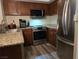 Well-lit kitchen featuring stainless steel appliances and granite countertops, perfect for culinary enthusiasts at 6800 E Lake Mead Blvd # 1126, Las Vegas, NV 89156