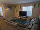 Comfortable living room with a sectional couch, modern décor, and natural light at 6800 E Lake Mead Blvd # 1126, Las Vegas, NV 89156