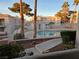 Relaxing pool area nestled among trees with surrounding residential buildings at 6800 E Lake Mead Blvd # 1126, Las Vegas, NV 89156