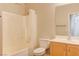 Bright bathroom featuring a shower-tub combination and wooden vanity with storage at 6826 Dovecote Ave, North Las Vegas, NV 89084