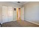 Neutral bedroom with a double door closet and neutral walls and carpet at 6826 Dovecote Ave, North Las Vegas, NV 89084