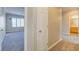 Hallway displaying neutral color palette leading into a bedroom and bathroom at 6826 Dovecote Ave, North Las Vegas, NV 89084