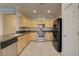 The kitchen features stainless steel appliances and beautiful stone countertops at 6826 Dovecote Ave, North Las Vegas, NV 89084