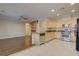 Open-concept kitchen and living room, ideal for entertaining, featuring modern appliances at 6826 Dovecote Ave, North Las Vegas, NV 89084