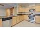 Modern kitchen features light wood cabinets and stainless steel appliances at 6826 Dovecote Ave, North Las Vegas, NV 89084