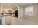 Charming kitchen boasts stainless steel appliances, a black refrigerator, and tiled flooring at 6826 Dovecote Ave, North Las Vegas, NV 89084