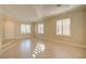 Bright living room featuring neutral paint, crown molding, tile floors, and natural light at 6826 Dovecote Ave, North Las Vegas, NV 89084
