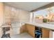 Outdoor kitchen boasts a stainless steel grill and ample counter space for entertaining in the backyard at 6826 Dovecote Ave, North Las Vegas, NV 89084