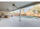 Covered patio with ceiling fans overlooks a beautiful pool and backyard, ideal for outdoor living and entertaining at 6826 Dovecote Ave, North Las Vegas, NV 89084