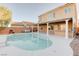 Backyard features a beautiful pool with covered patio, creating a serene and inviting outdoor space at 6826 Dovecote Ave, North Las Vegas, NV 89084