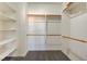 This walk-in closet has built in shelving and wood rods at 6826 Dovecote Ave, North Las Vegas, NV 89084