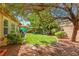 Beautifully landscaped backyard with healthy lawn and mature trees, great for outdoor living at 7252 Royal Melbourne Dr, Las Vegas, NV 89131