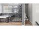 Modern bathroom featuring a glass shower, soaking tub, and updated fixtures at 7252 Royal Melbourne Dr, Las Vegas, NV 89131