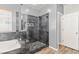 Modern bathroom featuring a glass shower, soaking tub, and neutral color scheme at 7252 Royal Melbourne Dr, Las Vegas, NV 89131