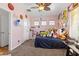 bedroom with pink walls, closet, carpet and ceiling fan at 7252 Royal Melbourne Dr, Las Vegas, NV 89131