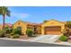 Inviting single-story home with a well-manicured lawn and a two-car garage at 7252 Royal Melbourne Dr, Las Vegas, NV 89131