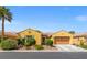 Charming single-story home with a well-manicured front yard and a spacious two-car garage in a quiet neighborhood at 7252 Royal Melbourne Dr, Las Vegas, NV 89131