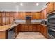 Spacious kitchen with ample cabinet space, granite countertops, and stainless steel appliances at 7252 Royal Melbourne Dr, Las Vegas, NV 89131