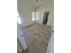 Neutral bedroom with wood-look floors and two windows providing natural light at 79 Magical Mystery Ln, Henderson, NV 89074